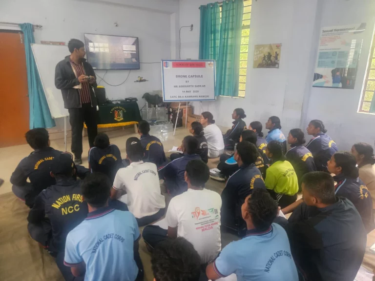 Speaker addressing NCC cadets seated in the hall during the drone training workshop