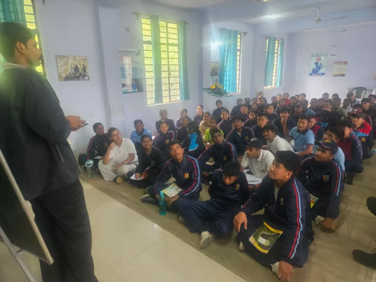 Trainer addressing a full hall of seated NCC cadets at the Gangtok workshop
