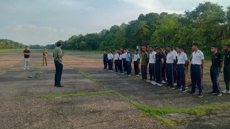 NCC cadets lined up on the runway with instructors during the competition