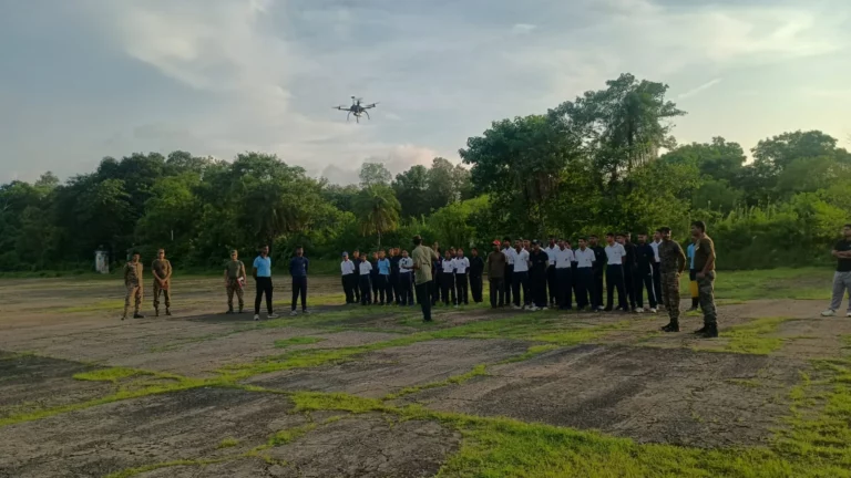 Cadets watching an FPV drone in flight over the airfield