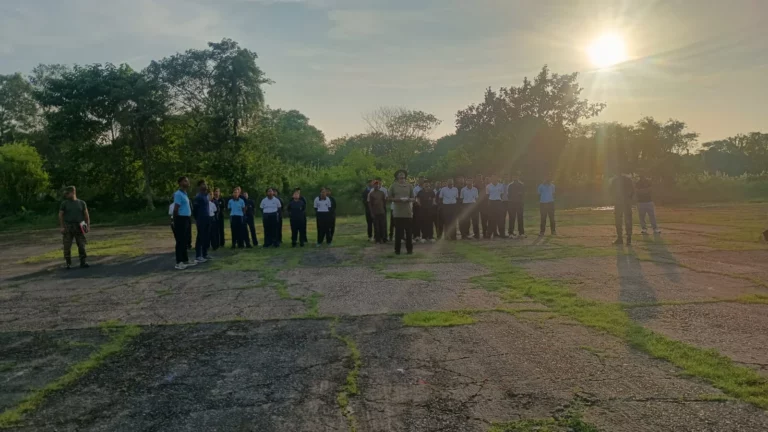 NCC cadets lined up on the airfield at sunset during the competition