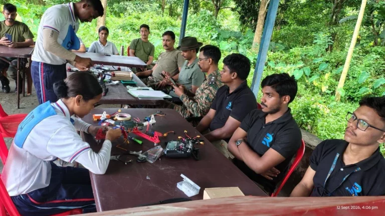 Hands-on drone assembly session with participants at work tables